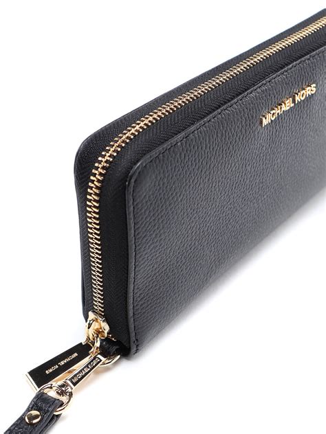 michael kors black jet set continental wallet|Michael Kors silver metallic wallet.